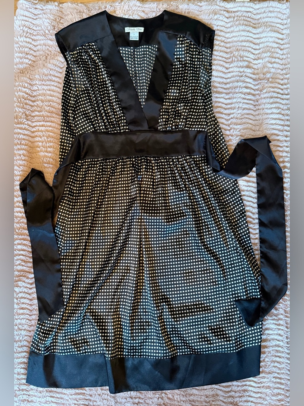 Silky black and white dress with flattering waist sash